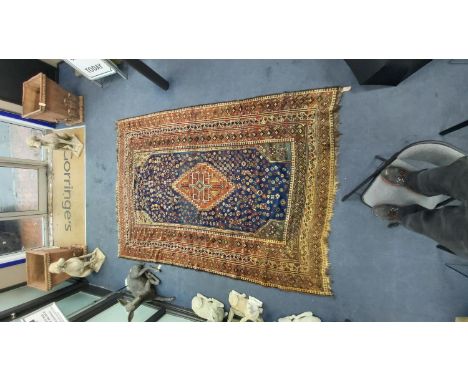 A Shiraz blue ground carpet, 305 x 214cm