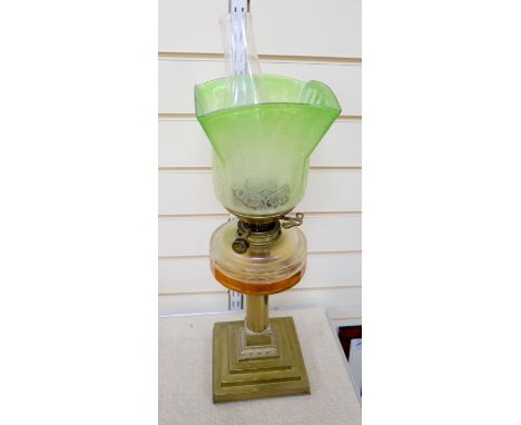 An Edwardian brass and glass oil lamp