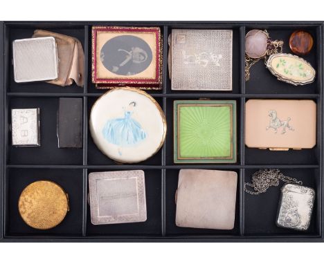 A group of vintage compacts, including a silver example with engine turned decoration, Stratton poodle Mickey Mouse, other co