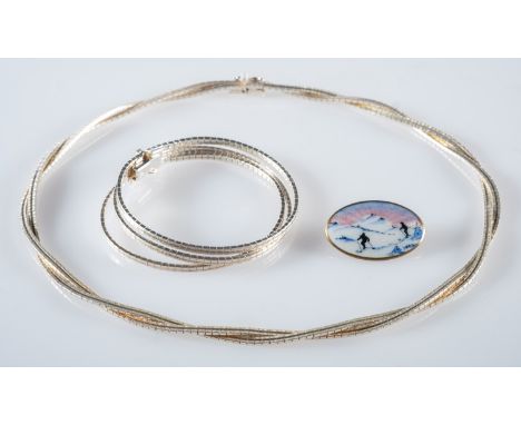 A silver necklet, bracelet and a Norwegian enamel brooch, a silver two strand necklet with polished and patterned links, mark