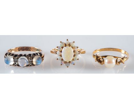 A group of three 9ct yellow gold rings, to include a 9ct pearl set ring, UK hallmark, size N, 1.55grams; a 9ct cluster ring s