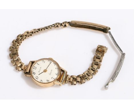 Avia 9 carat gold ladies wristwatch, the signed white dial with Arabic markers, manual wound, on a rolled gold bracelet, 14g 
