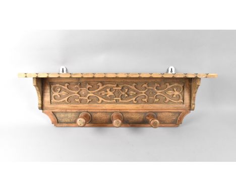 A Pine Carved Wall Hanging Coat/Hat Rack, with Shelf Top, 68cms Wide 