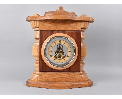 An Oak Cased Mantel Clock with Skeleton Battery Movement 