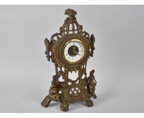 An Ornate Cast and Pierced Brass Clock, 36cms High 