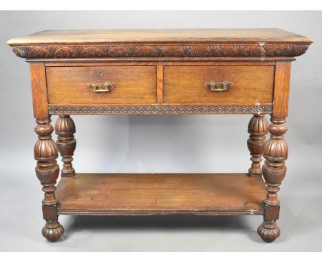 An Oak Side Table or Buffet Having Two Short Drawers on Folded Supports with Stretcher Shelf and Carved Detailing, 107x50x82c