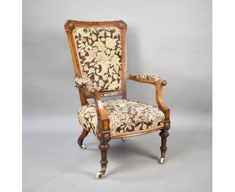 A Late Victorian/Edwardian Ladies Armchair with Tapestry Upholstery on Turned Supports Culminating in Castors 