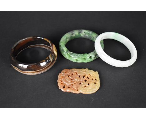 Two Chinese Jade Bangles Together with an Agate Example and a Chinese Carved Amulet 