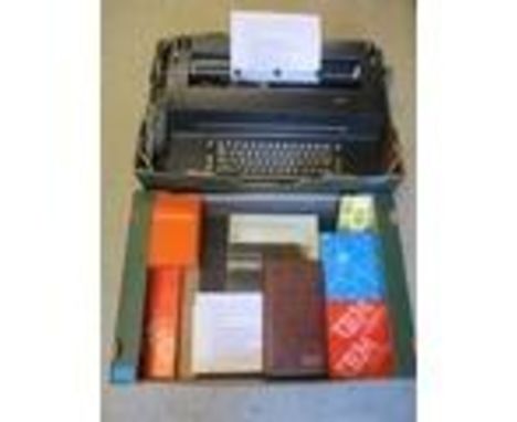 An IBM Selectric model 82 typewriter in mat black, golf ball type electric typewriter, date 28/2/1979, with cased golf balls,