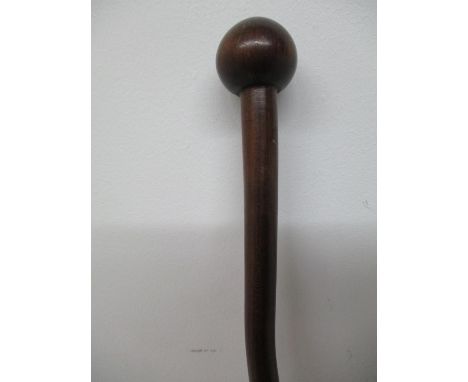 An early 20th century hardwood walking stick with a bulbous handle, on a part spiral carved, tapered column, 41 1/4"h 