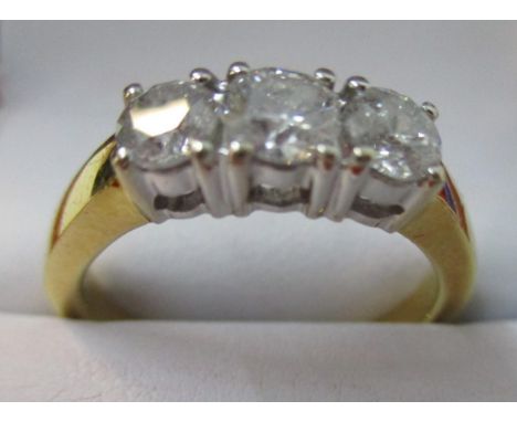 An 18ct gold diamond ring set with three almost uniform stones, approximately 1ct, size P, 5.5g 