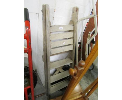 A vintage wooden folding step ladder 