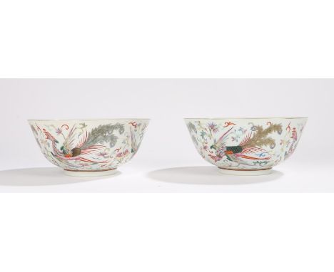 Pair of Chinese porcelain bowls, Kangxi style, decorated in polychrome enamels with phoenix among foliate scrolls, six charac