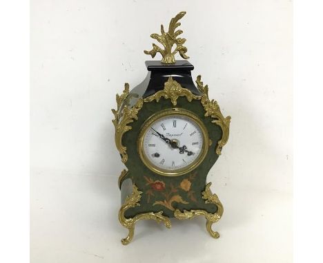 A rococo inspired mantle clock with flame finial, dial marked Imperial, made in Italy, on C scroll feet (36cm x 18cm x 11cm)