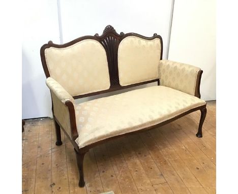 A reproduction sofa with central pierced splat flanked by upholstered panels, with slightly scrolling arms over a bow front s