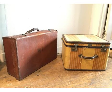 A vintage travelling case with striped canvas exterior, bearing plaque stamped Oshkosh Luggage (32cm x 47cm x 45cm) and anoth