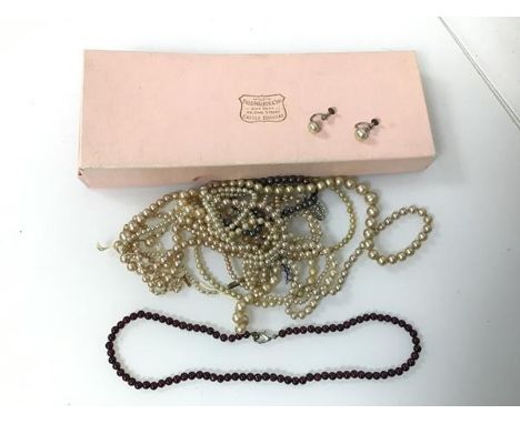 An assortment of imitation pearl necklaces and a pair of imitation pearl earrings and a garnet bead necklace (19cm)