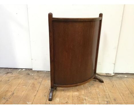 A 1920s/30s oak firescreen with convex panel (72cm x 65cm x 20cm)