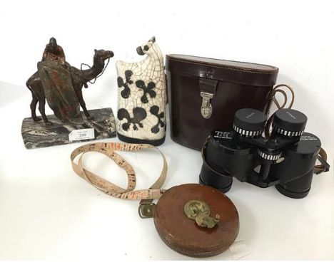 A mixed lot including a vintage tape measure in leather case, marked Chesterman, Sheffield (d.12cm) and a spelter figure of a