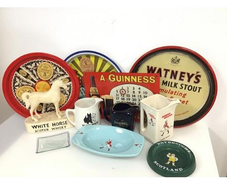 A collection of beer and whisky paraphernalia including a Black and White Scotch whisky water jug, a White Horse Scotch whisk