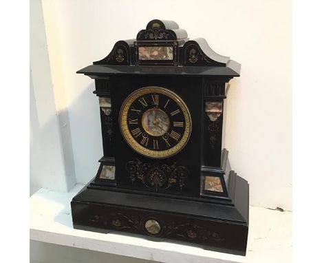 A Victorian slate mantel clock of architectural form, with foliate decoration and agate panels (49cm x 41cm x 19cm)