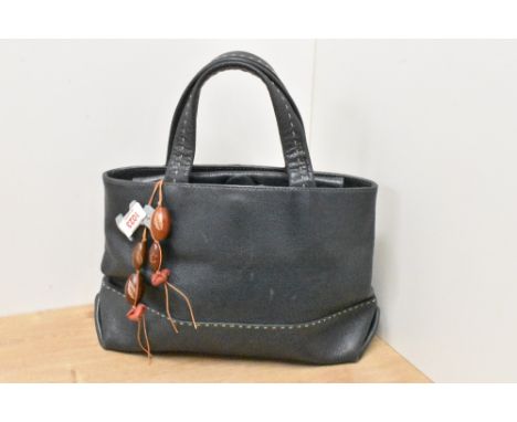 A ladies blue leather Radley handbag, of stitched construction with internal polka dot design and inner purse section.