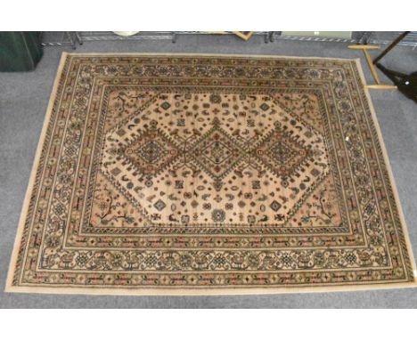 A modern Belgian machine made wool rug, of Europeanised Persian design, 227cm x 169cm