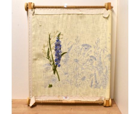 A large modern needlework/tapestry frame with incomplete floral design needlework panel attached, 73cm x 57cm
the material is