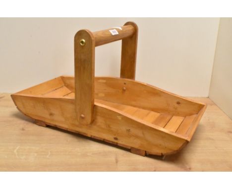 A decorative stained pine garden trug with over handle, 55cm x 26cm
