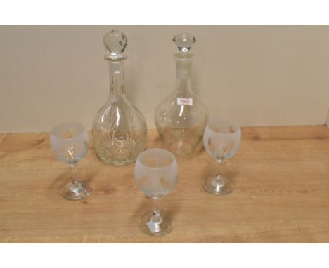 Three acid etched glass cat design wine glasses, a mallet form cut-glass decanter and a glass decanter engraved with fruiting