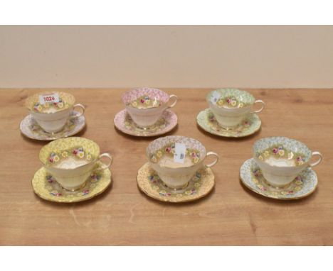 A Group of six Paragon Damask Rose pattern fine china tea cups and saucers, each decorated in differing pale tones, printed m