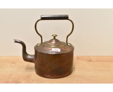 An early 20th century brass and copper kettle, of traditional design 29cm