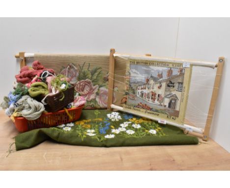 Two tapestry frames with uncompleted woolworks, to include an assortment of wool