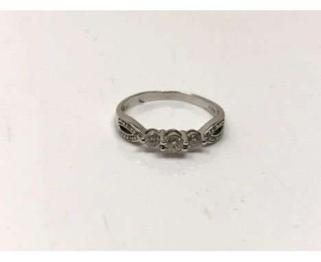 A 14ct white gold diamond set ring, size R CONDITION REPORT: 2.6g. 