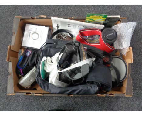 A box containing assorted cameras to include a Canon EOS 500 with lens, Panasonic video camera with accessories etc  