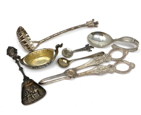 A group of silver and other items including caddy spoon, strainer, salt, grape scissors etc