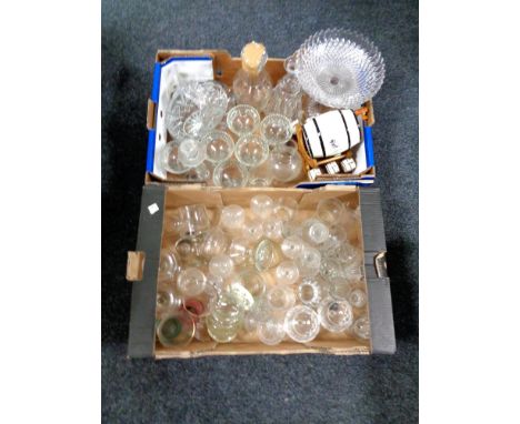Two boxes of assorted glass ware to include drinking glasses, candlestick, comport, decanters, together with a ceramic barrel