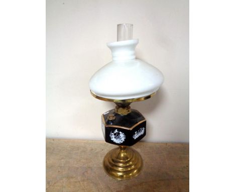 A Duplex brass oil lamp with ceramic reservoir, chimney and shade 