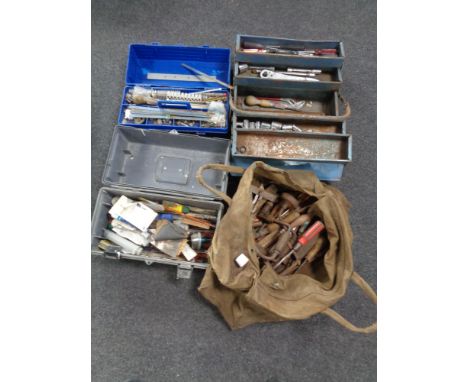 A canvas bag of three tool boxes containing assorted hand tools  