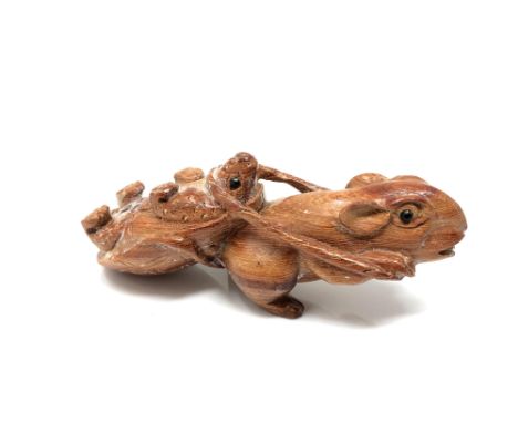 A carved hardwood Chinese netsuke - Rat pulling a turtle