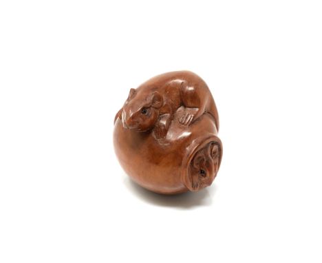 A carved hardwood Chinese netsuke - Two rats on a barrel 