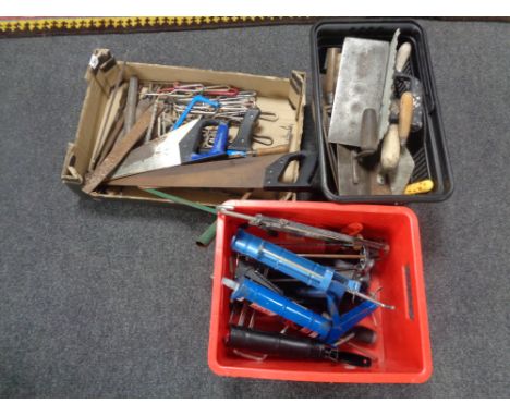 A box and two plastic crates containing assorted tools to include hand saws, files, plastering tools, cartridge guns etc    