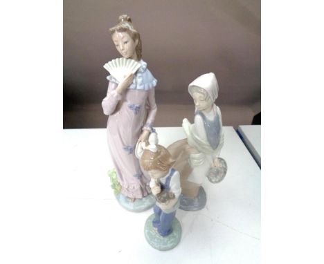 Three Nao figures, girl with doll, girl with basket, lady with fan  