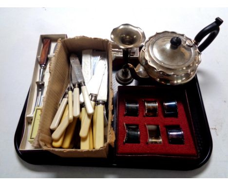 A tray containing plated wares to include teapot, bud vase, cased napkin rings together with a quantity of boxed and unboxed 