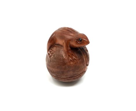 A carved hardwood Chinese netsuke - Frog on a fruit