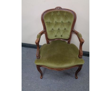 A beech framed salon armchair upholstered in a green button dralon  