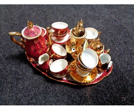 A fifteen piece Bavarian gilded tea service on tray together with a further fifteen piece Bavarian china tea service 