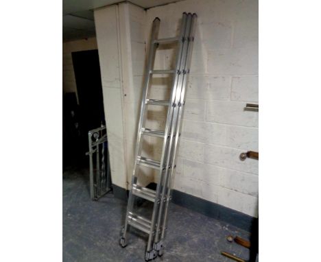 A Youngman triple extension aluminium ladder 