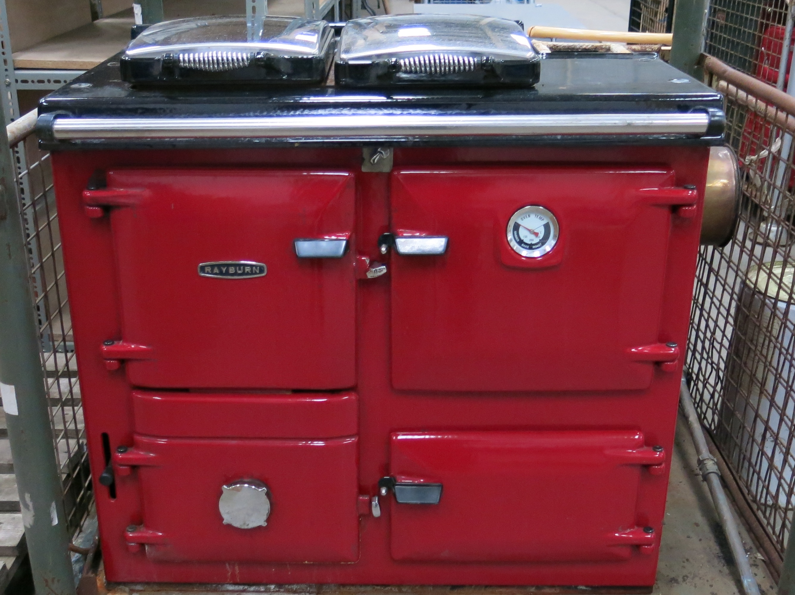 A Rayburn solid fuel oven with hot plate to the top, 4 x doors to the ...