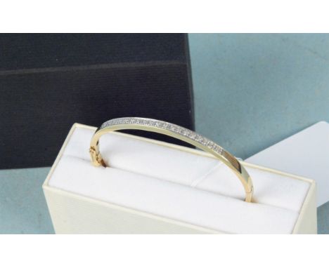 A 9ct gold diamond set bangle, weight approx 7g